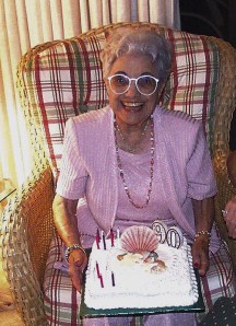 woman smiling with 90th birthday cake
