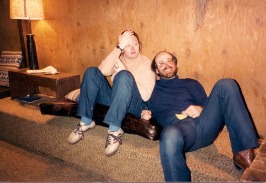 Two Tired Skiiers 1970s photo of couple lolling after skiing