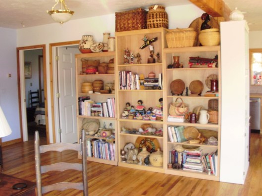 three book shelves with antique items