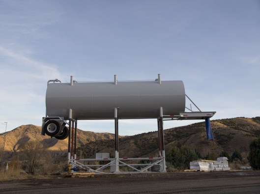 large water tanker truck elevated on stilts