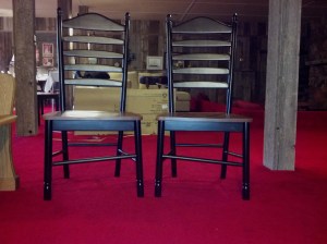 two ladderback chairs with crooked rungs