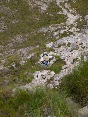 Hikers slowing scending a rocky trail