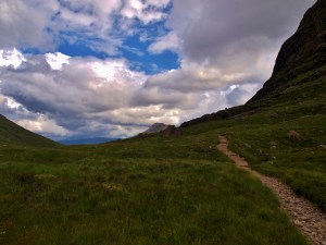 mountain pass with blue sky and clouds
