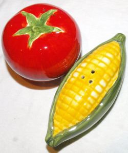 closeup of corn and tomator shaped salt and pepper shakers
