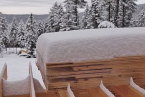 snow piled up on buidling materials showing unique patterns from the way the snow fell