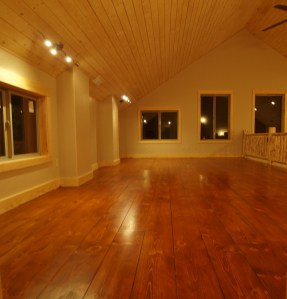 empty room showing newly finished floor which is a deep red brown with a satin finish